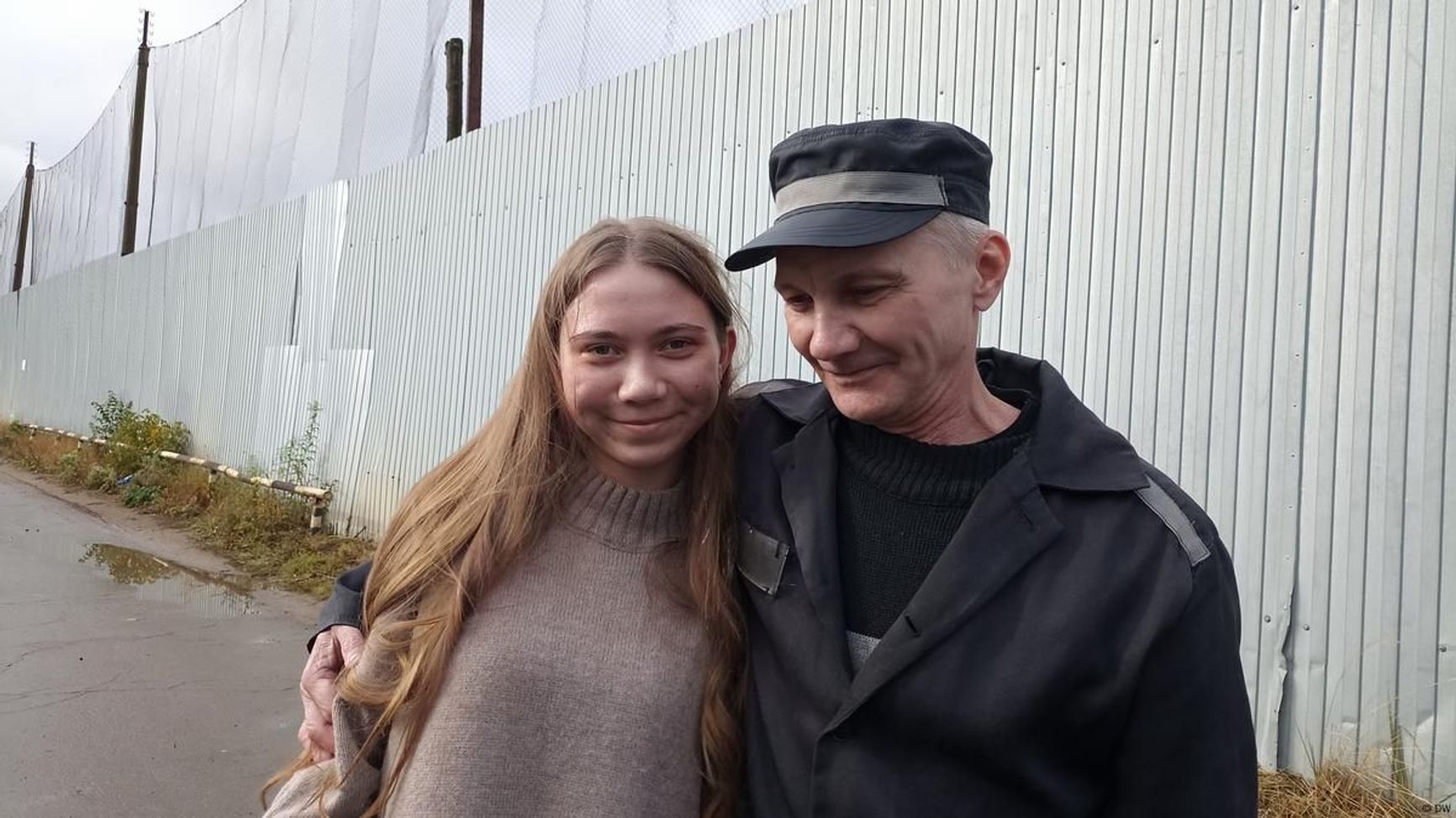 Alexei Moskalev hugs his daughter Masha after being released from a Russian prison